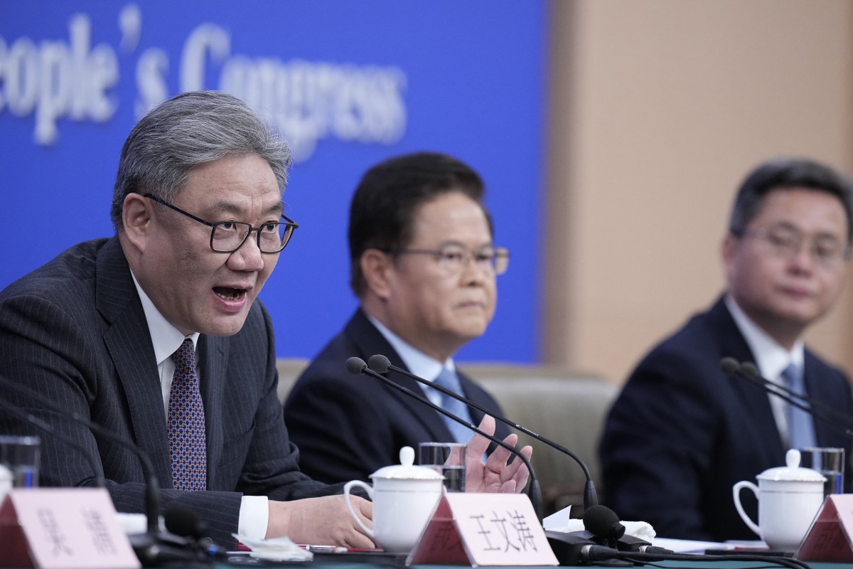 China's Minister of Commerce Wang Wentao attends a new conference on economy for the fourth session of the 14th National People's Congress (NPC) in Beijing, China. (AFP)