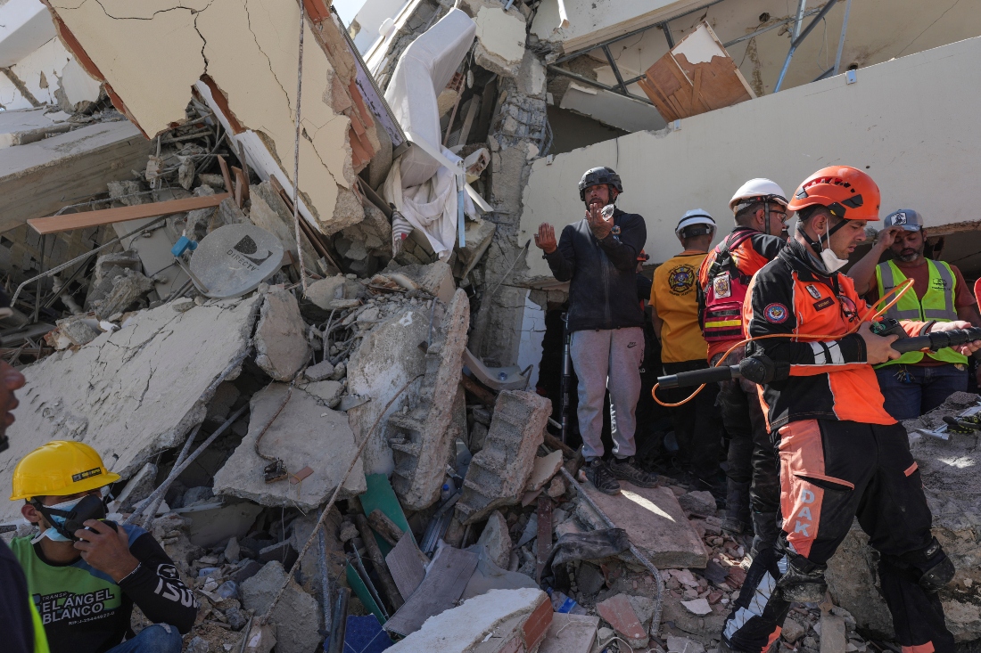 Rescue teams searching for survivors trapped under the rubble in La Guaira, Venezuela. (AP)