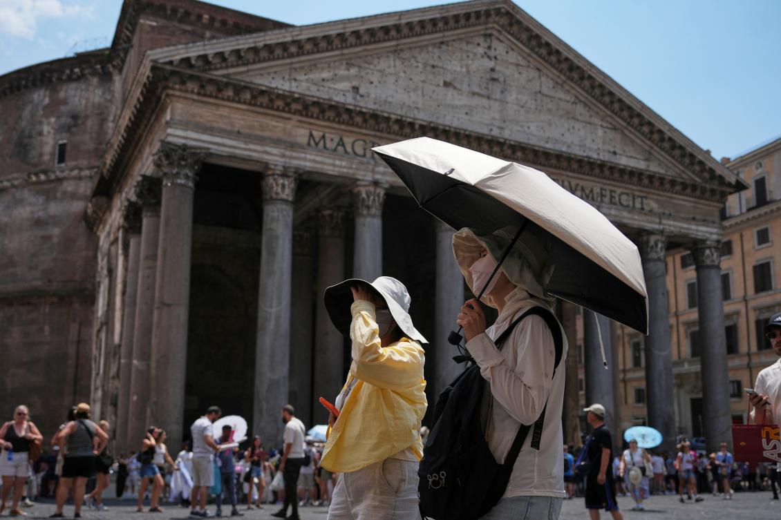 Above, tourists use umbrellas to take shelter from the sun in Pantheon Square in Rome on June 29, 2026. (AP)