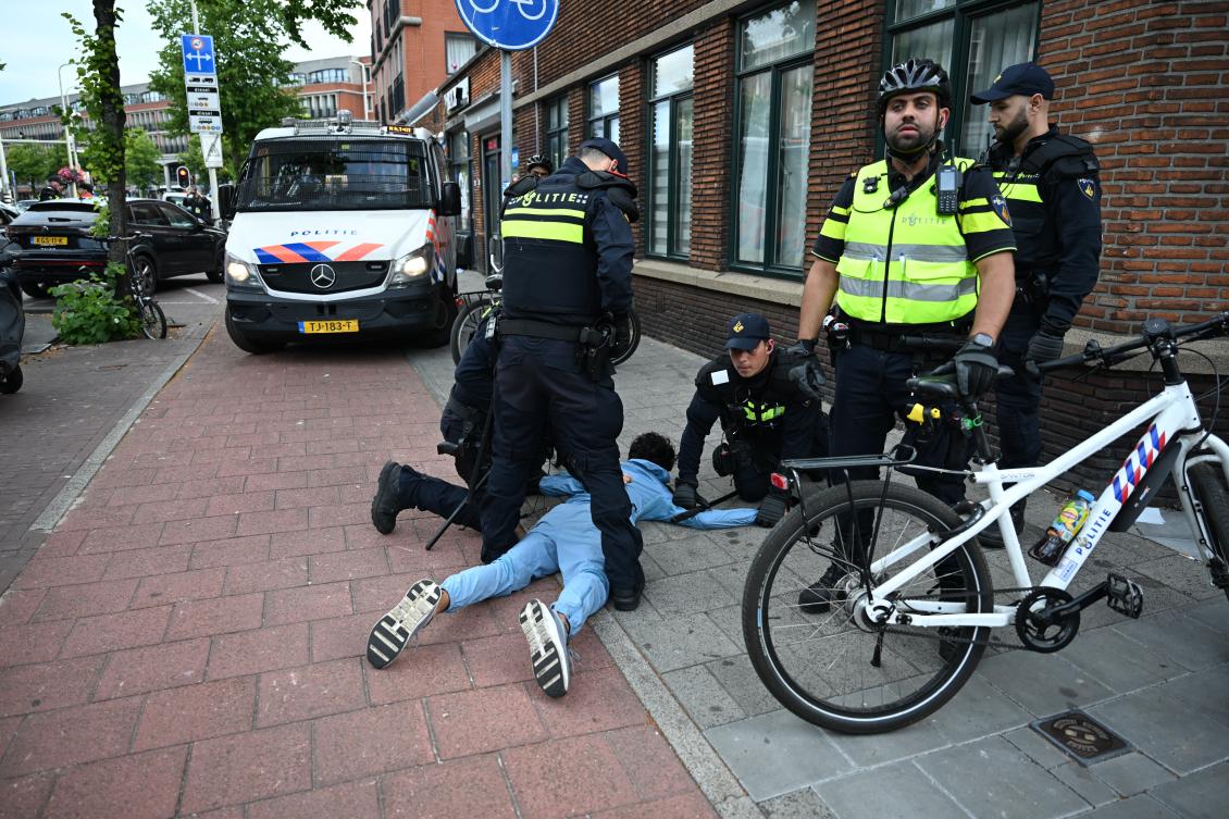 Police arrest a Moroccan fan after a World Cup soccer match between the Netherlands and Morocco in The Hague, Jun. 30, 2026. (AP)