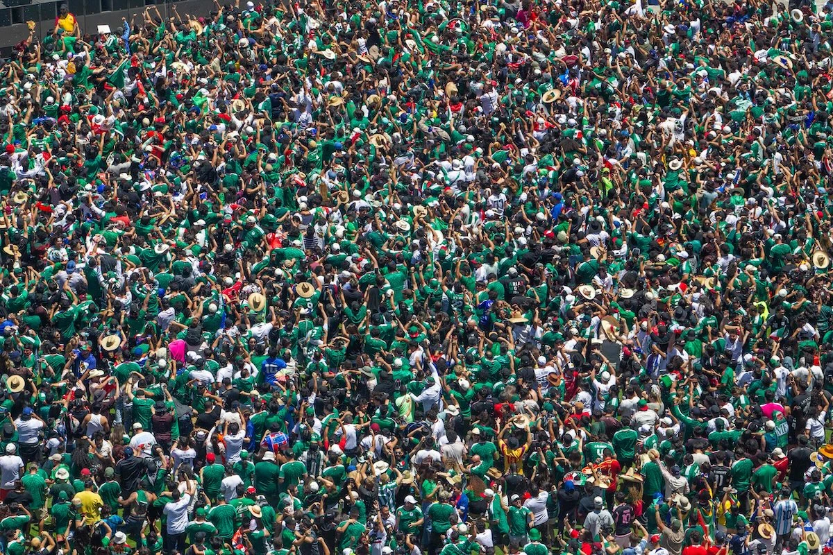 Mexico fans celebrate a goal scored by Julian Quinones during the FIFA Fan Festival at the LA Memorial Coliseum in Los Angeles on June 11, 2026. (AFP)