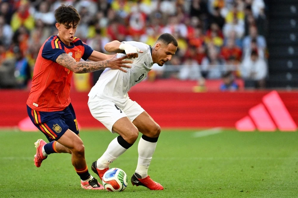Second-string Spain held by Iraq in low-key World Cup send-off