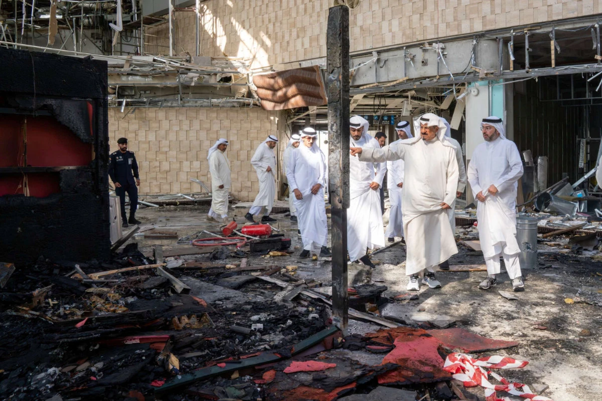 This photo taken on June 3, 2026, shows Kuwaiti officials inspecting damage inside a terminal at Kuwait International Airport following a drone and missile attack. (Kuwait News Agency/Handout via REUTERS)