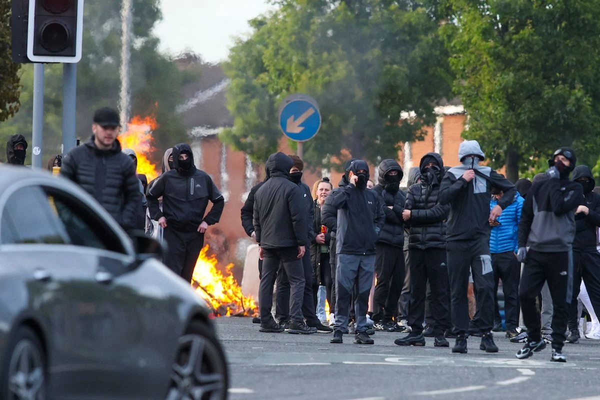 Protesters torch vehicles after 'sickening' Belfast stabbing
