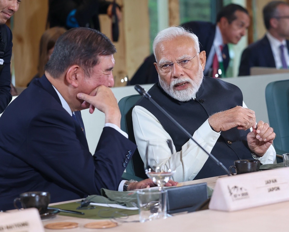 In this file photo, Indian Prime Minister Narendra Modi talks with former Japan Prime Minister Shigeru Ishiba during the Group of Seven Summit in Canada on June 18, 2025. (Prime Minister's Office)