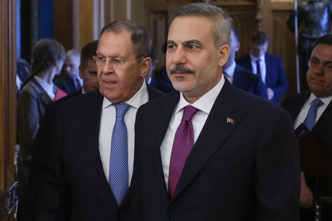 Russian Foreign Minister Sergey Lavrov and Turkish Foreign Minister Hakan Fidan enter a hall for their talks at Zinaida Morozova's Mansion in Moscow, Russia. (AP)