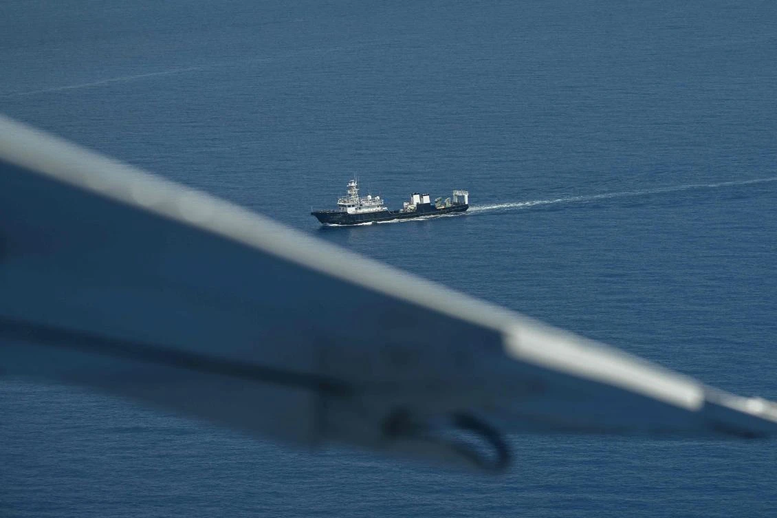 Above, a ship identified by the Philippine Coast Guard as Chinese maritime militia is seen at Scarborough Shoal in the disputed South China Sea on June 15, 2026. (AFP)