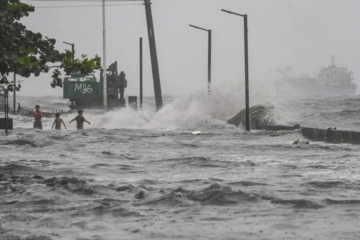 Offshore typhoon threatens 2 northern Philippine provinces with possible flooding and rough seas