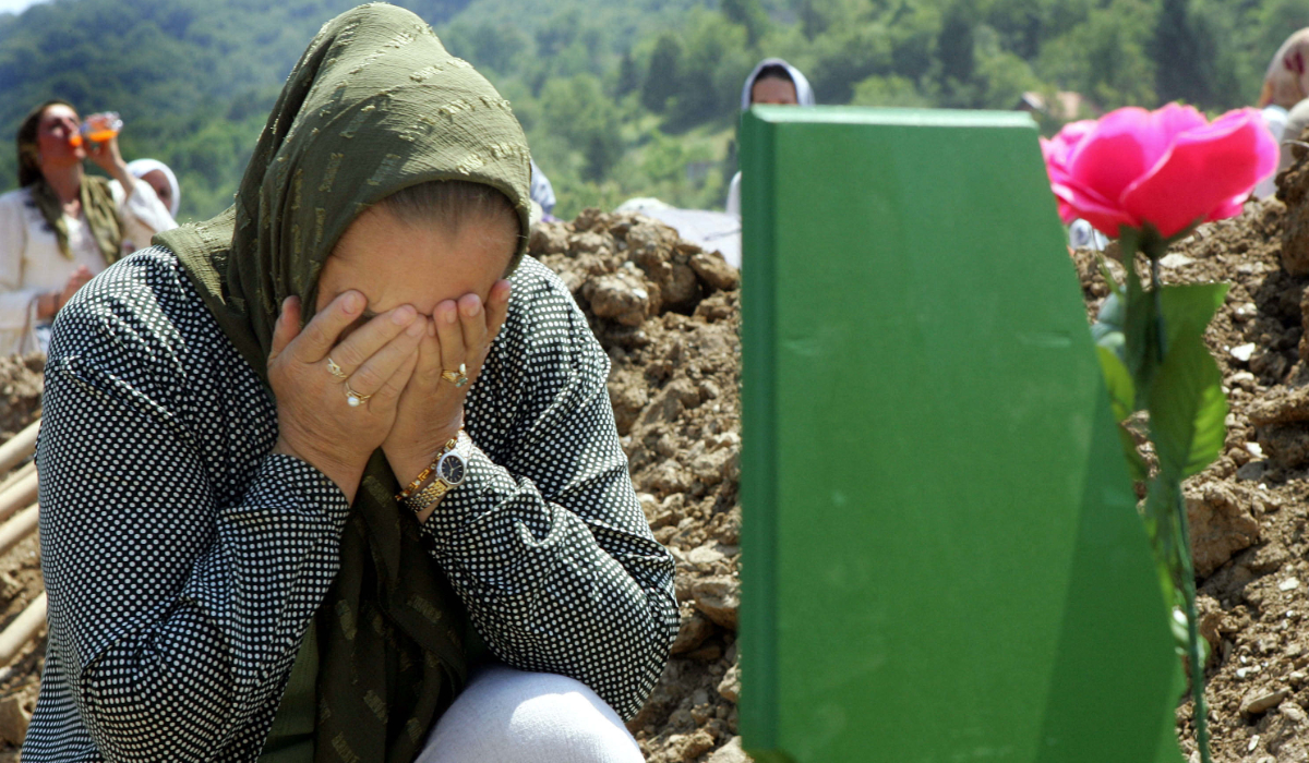 Bosnian Muslim woman cries before burying remains of her relative in Potocari, near Srebrenica on July 11, 2004. (AFP)