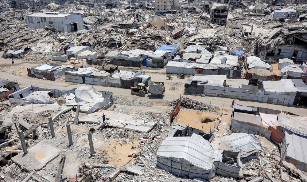 Tents and shelters are pictured next to rubble from collapsed buildings, Sheikh Radwan, Gaza City, July 6, 2026. (AFP)