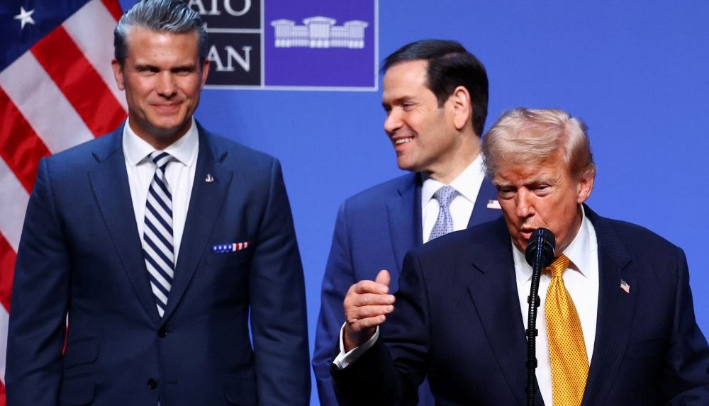 Pete Hegseth and Marco Rubio stand behind Donald Trump as he speaks to the media, Ankara, Turkiye, July 8, 2026. (Reuters)