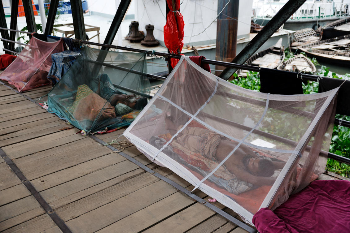 People sleep using mosquito nets, following a surge of dengue-infected patients, in Dhaka, Bangladesh, June 25, 2025. (REUTERS)