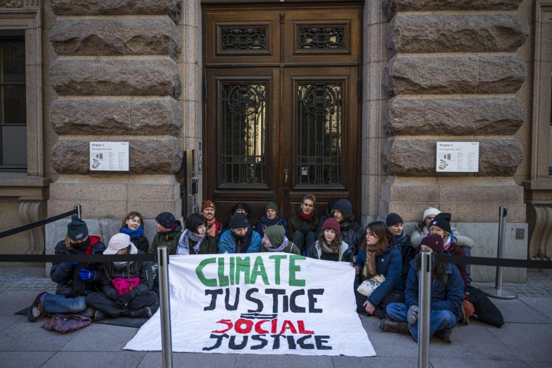 Swedish climate activist Greta Thunberg (3rd L) and fellow activists block the main entrances of the Swedish Parliament during a protest due to the lack of action from the Swedish authorities, on March 11, 2024, in Stockholm, Sweden. (File/AFP)