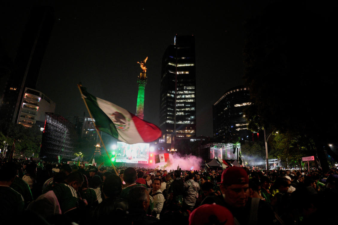Supporters of Mexico celebrate near the Angel of Independence on June 30, 2026 after Mexico won their game against Ecuador. (Reuters)