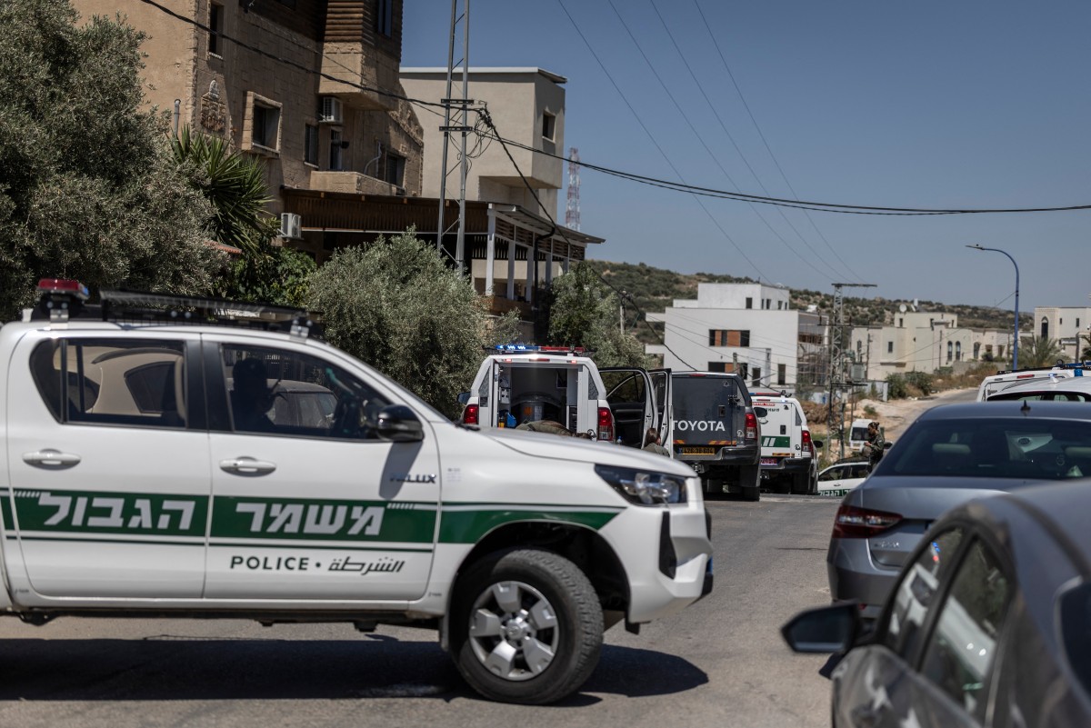 An Israeli border police vehicle blocks a street in the Arab city of Tayibe as security forces search the area following multiple shooting attacks in Israel, June 7, 2026. (Files/AFP)