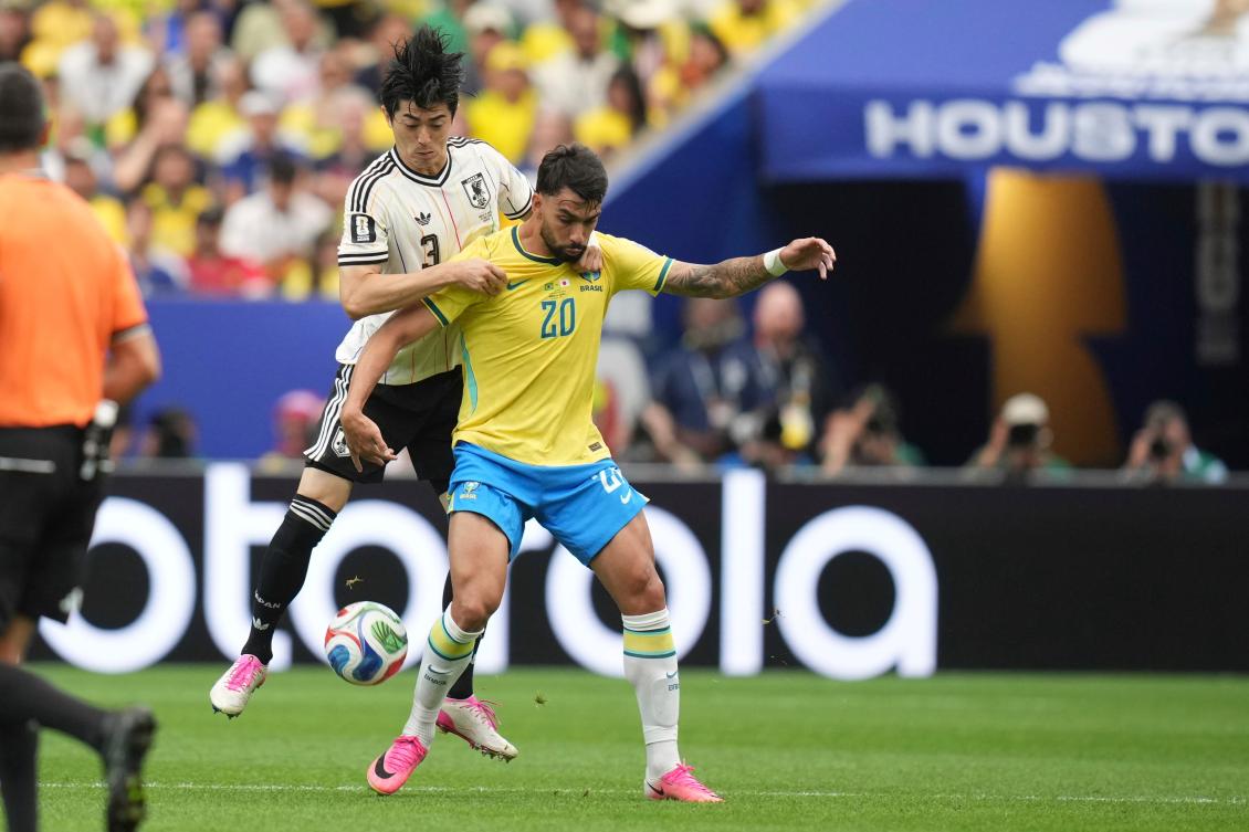 Brazil’s Lucas Paqueta (20) challenges for the ball with Japan’s Shogo Taniguchi (3) during their FIFA World Cup round of 32 match in Houston, Jun. 29, 2026. (AP)