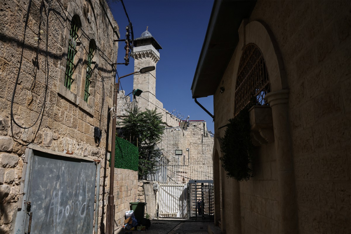 A photograph shows the minaret of the Ibrahimi Mosque, known to Jews as the Cave of the Patriarchs, located inside the Israeli-controlled H2 sector of the occupied West Bank city of Hebron, June 16, 2026. (AFP)