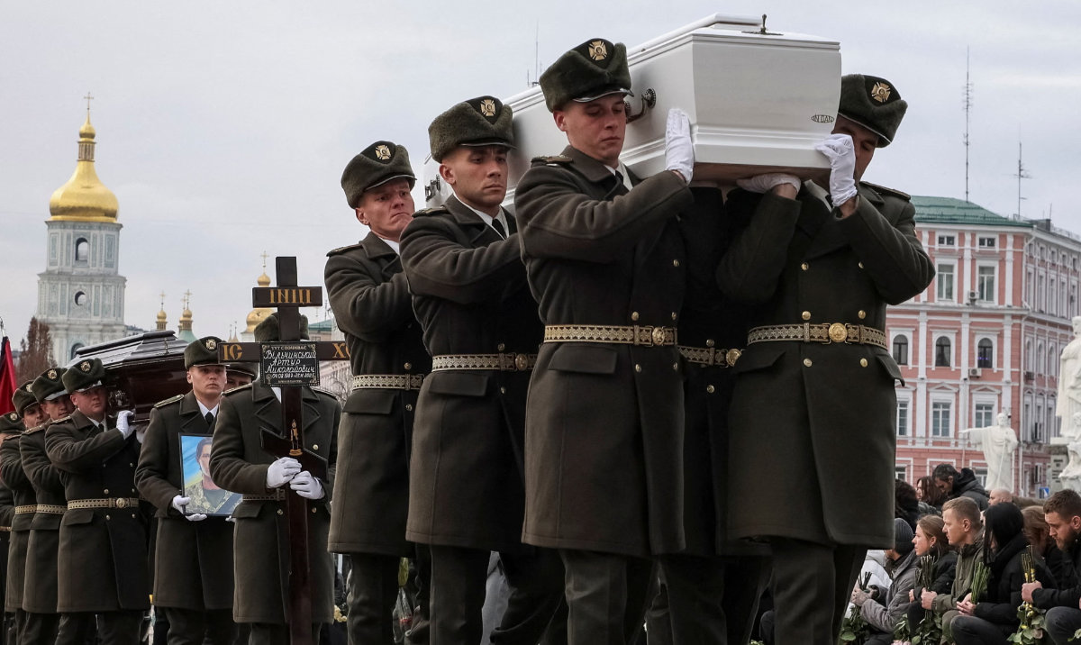 Ukrainian service members carry coffins during a funeral ceremony in Kyiv. (Reuters/File)