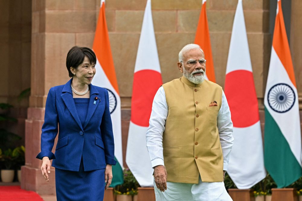 Japanese Prime Minister Sanae Takaichi and Indian Prime Minister Narendra Modi walk together before their meeting at the Hyderabad House in New Delhi on July 2, 2026. (AFP)