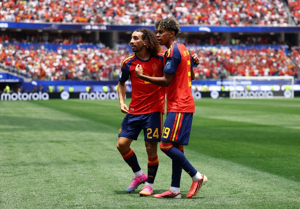 Spain’s Marc Cucurella celebrates scoring their first goal with Lamine Yamal. (Reuters)