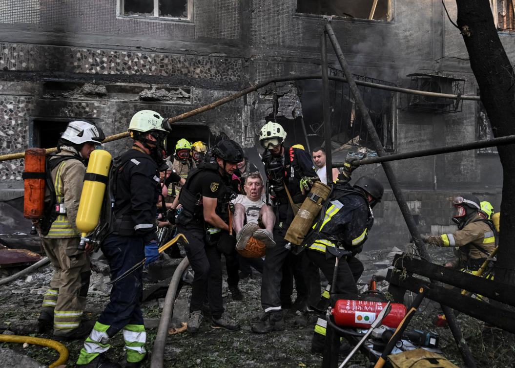First responders evacuate a person from an apartment building hit by a Russian drone strike, in Zaporizhzhia, Ukraine Jul. 3, 2026. (Reuters)