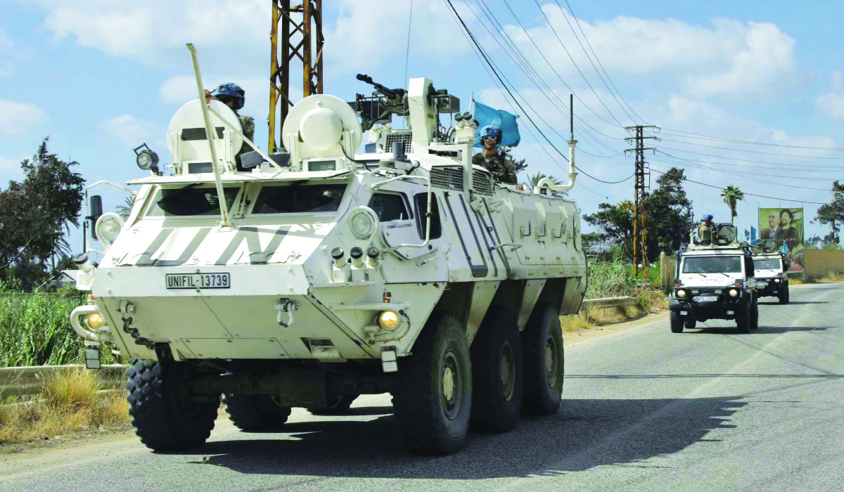 A convoy of the UN Peacekeeping Force in Lebanon drives through the southern Lebanese area of Al-Mansouri. Israeli officials have repeatedly ruled out withdrawing troops from southern Lebanon. (AFP)