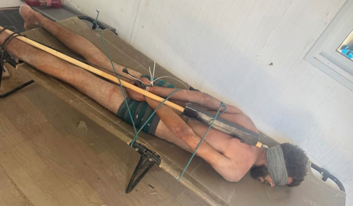 A Palestinian man from Gaza lies blindfolded, stripped to his underwear and restrained face down on a cot while in Israeli custody in this picture released June 30, 2026 and obtained by Reuters on July 4, 2026. (REUTERS)