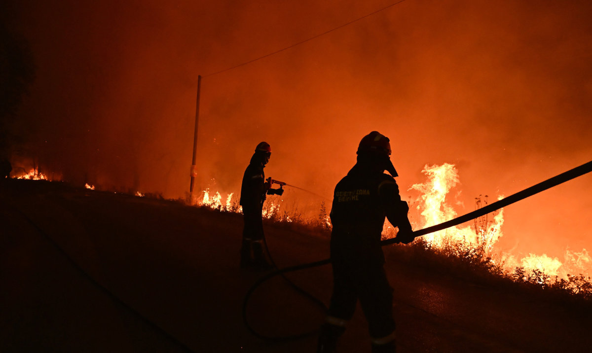 Firefighters work on a wildfire on the outskirts of the northern city of Thessaloniki, Greece, Sunday, July 5, 2026. (AP)