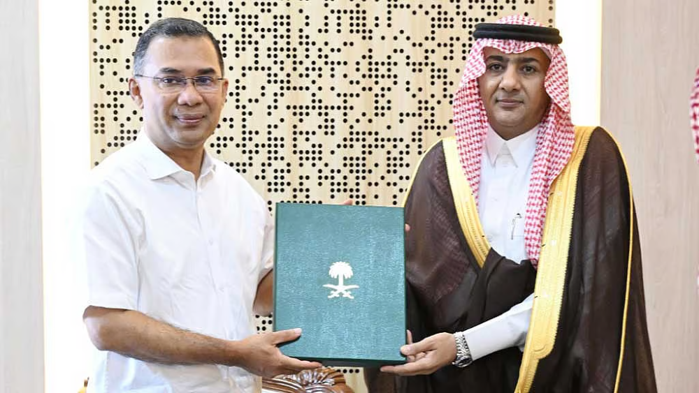 Saudi Ambassador Abdullah bin Abiyah, right, presents PM Tarique Rahman, left, with an official invitation to visit the Kingdom, in Dhaka, July 6, 2026. (Bangladesh Ministry of Foreign Affairs)