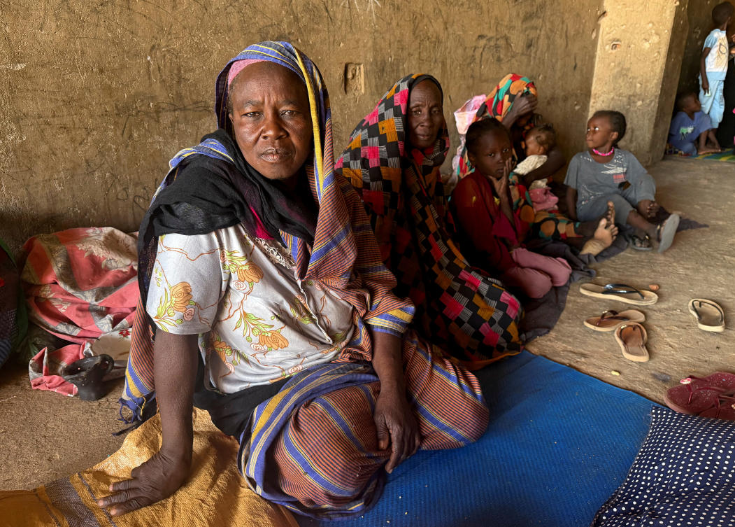 Displaced women from South Kordofan sit on the ground in El-Obeid, North Kordofan State, Sudan, Jan. 15, 2026. (Reuters)