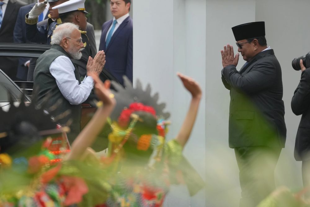 India's PM Narendra Modi, left, is greeted by Indonesian President Prabowo Subianto at Merdeka Palace, Jakarta, July 7, 2026. (AP Photo)