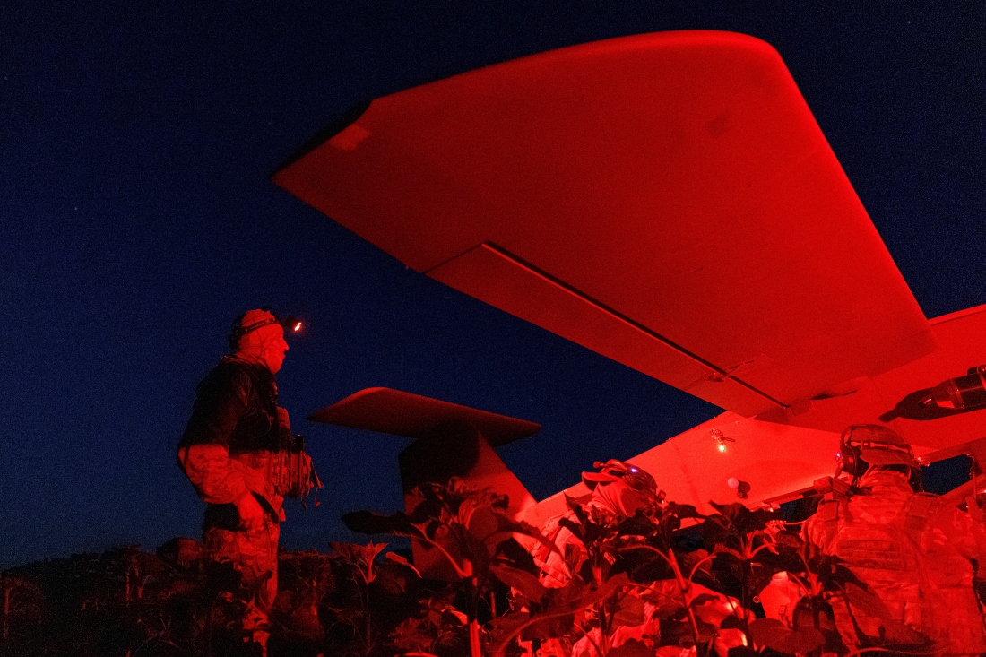 Service members of the Sparta company of the 422nd Unmanned Systems Regiment 'Luftwaffe' of the Ukrainian Armed Forces, prepare a Zozulia mid-strike drone for a flight while they work at a position near a front line in southern Ukraine. (Reuters)