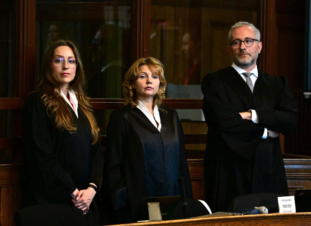 The court-appointed defendant’s lawyers, Klaudia Dawidowic (L-R), Ria Halbritter and Christoph Stoll wait for the start of the trial of a palliative care doctor allegedly accused of killing 15 patients with lethal injections, in the Regional Courtroom in Berlin, on Jul. 14, 2025. (AFP)