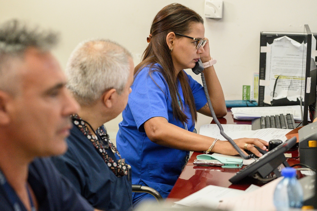 Cuban doctor Zoila Yakelin Arevalo Cruz, right, talks on the phone in the emergency unit of the Santa Maria degli Ungheresi Hospital of Polistena, in the southern Italian Calabria region. (AP)