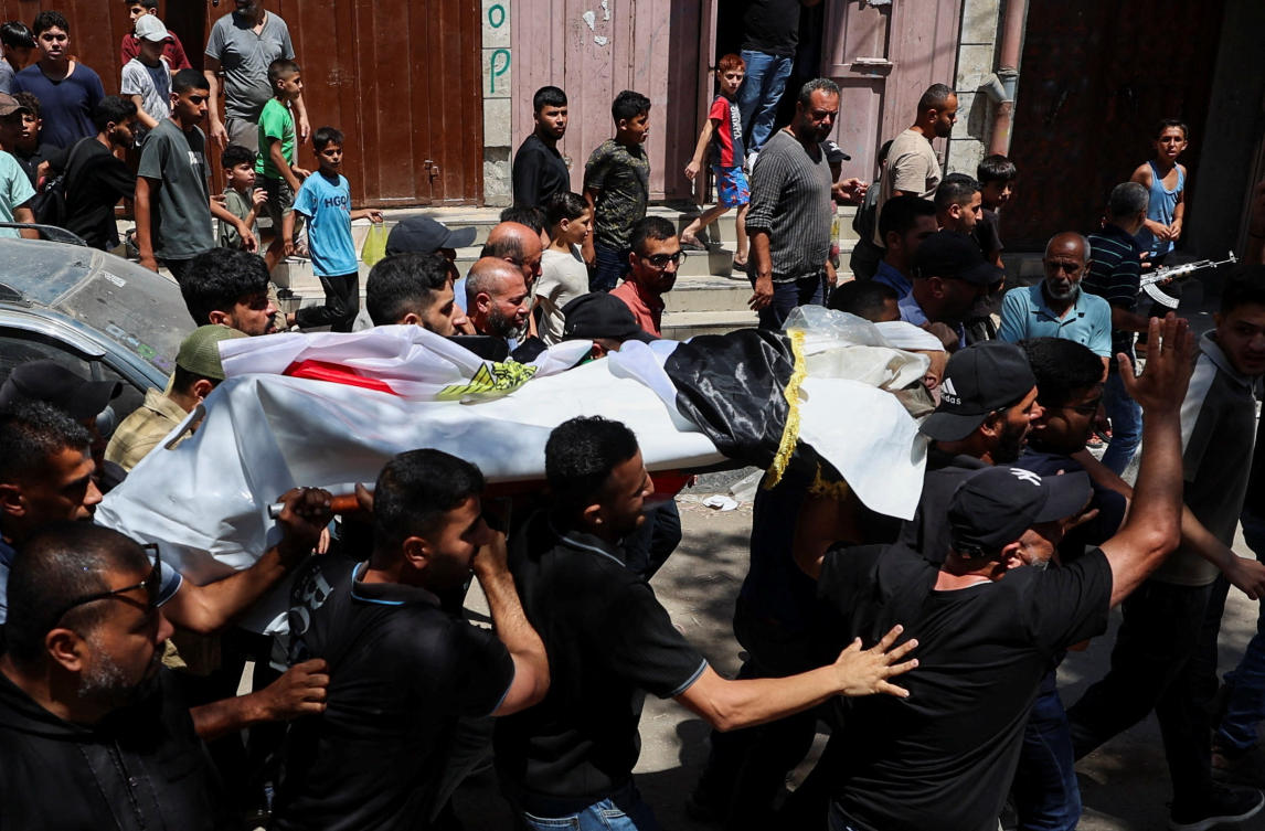 The funeral in Gaza City for Palestinian aid work Mohammad Al-Waheidi, who was killed in an Israeli strike on Tuesday. (Reuters)