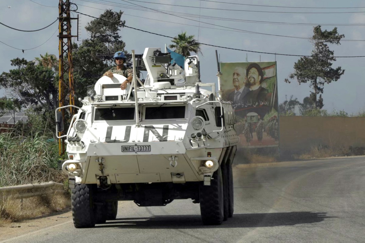 Members of UN Peacekeeping Force in Lebanon drive through southern Lebanese area of Al-Mansouri. (AFP file photo)