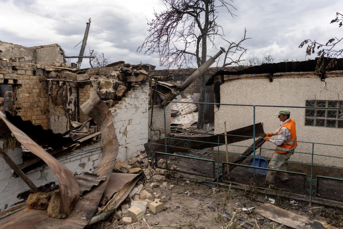 A worker removes debris from a house that was destroyed by Russian missile and drone strikes in Vyshneve, outside Kyiv, Ukraine, Jul. 7, 2026. (Reuters)