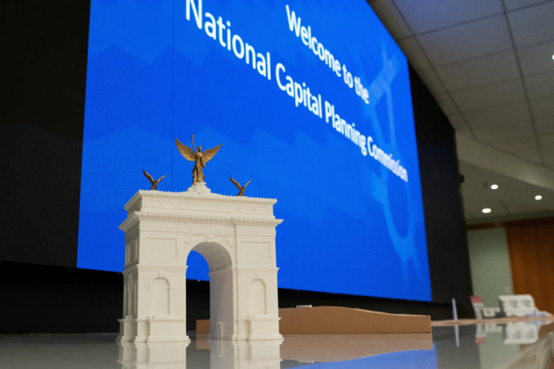 A model of US President Donald Trump’s proposed 259-foot triumphal arch is displayed on a table at a National Capital Planning Commission meeting in Washington on July 9, 2026. (Reuters)