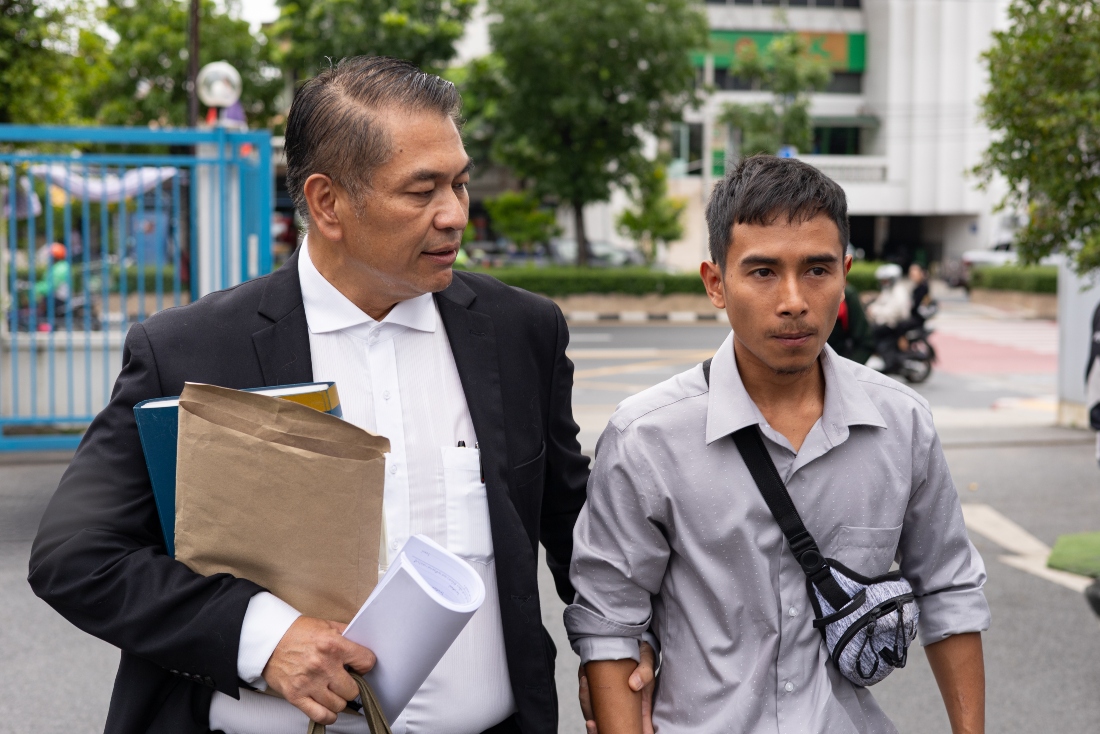 Lawyer Kunpat Singhathong and Noppadon Wongsuvan, a former sailor from the Thailand-flagged ship, the Mayuree Naree, walk towards the Central Labour Court in Bangkok, Thailand. (AP)
