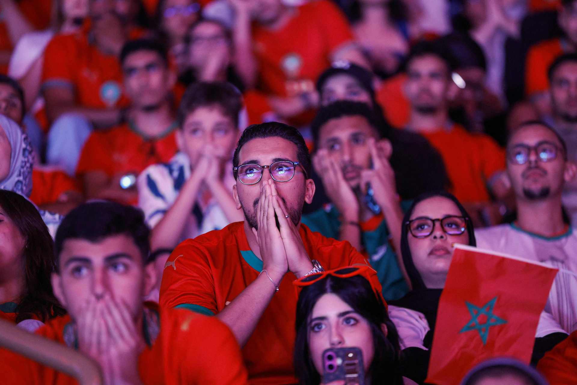 Morocco fans react as they watch their team's quarter-final match against France in the 2026 World Cup football tournament being played in the US at Prince Moulay Abdellah Stadium, converted into a fan zone, in Rabat on July 9, 2026. (AFP)