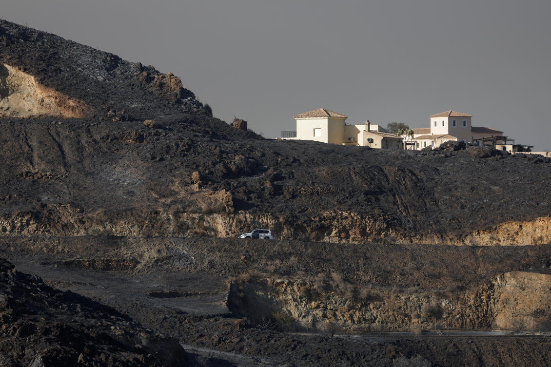 A Spanish Civil Guard vehicle drives amid burnt vegetation during deadly wildfires affecting Almeria province, in Bedar, Spain, Jul. 10, 2026. (Reuters)