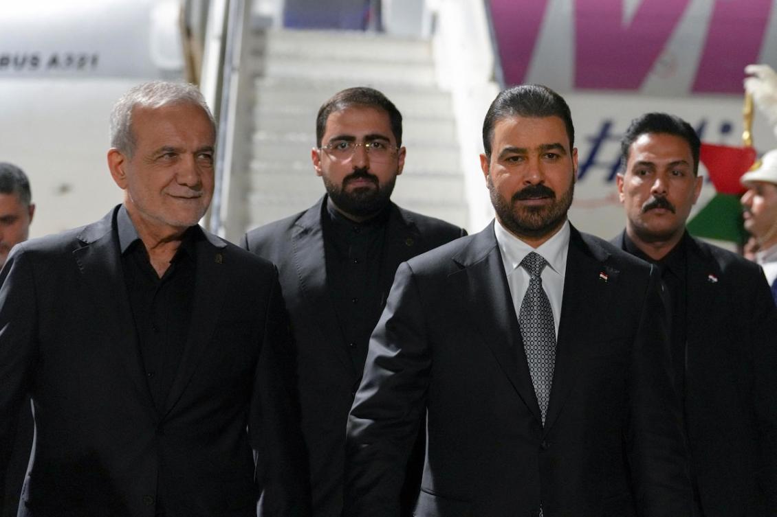 This handout picture released by the Iraqi Prime Minister's Office shows Iraqi Prime Minister Ali al-Zaidi (C-R) welcoming Iranian President Masoud Pezeshkian (L) at Najaf Airport ahead of funeral ceremonies for Iran's slain leader Ayatollah Ali Khamenei on July 7, 2026. (FILE/AFP)
