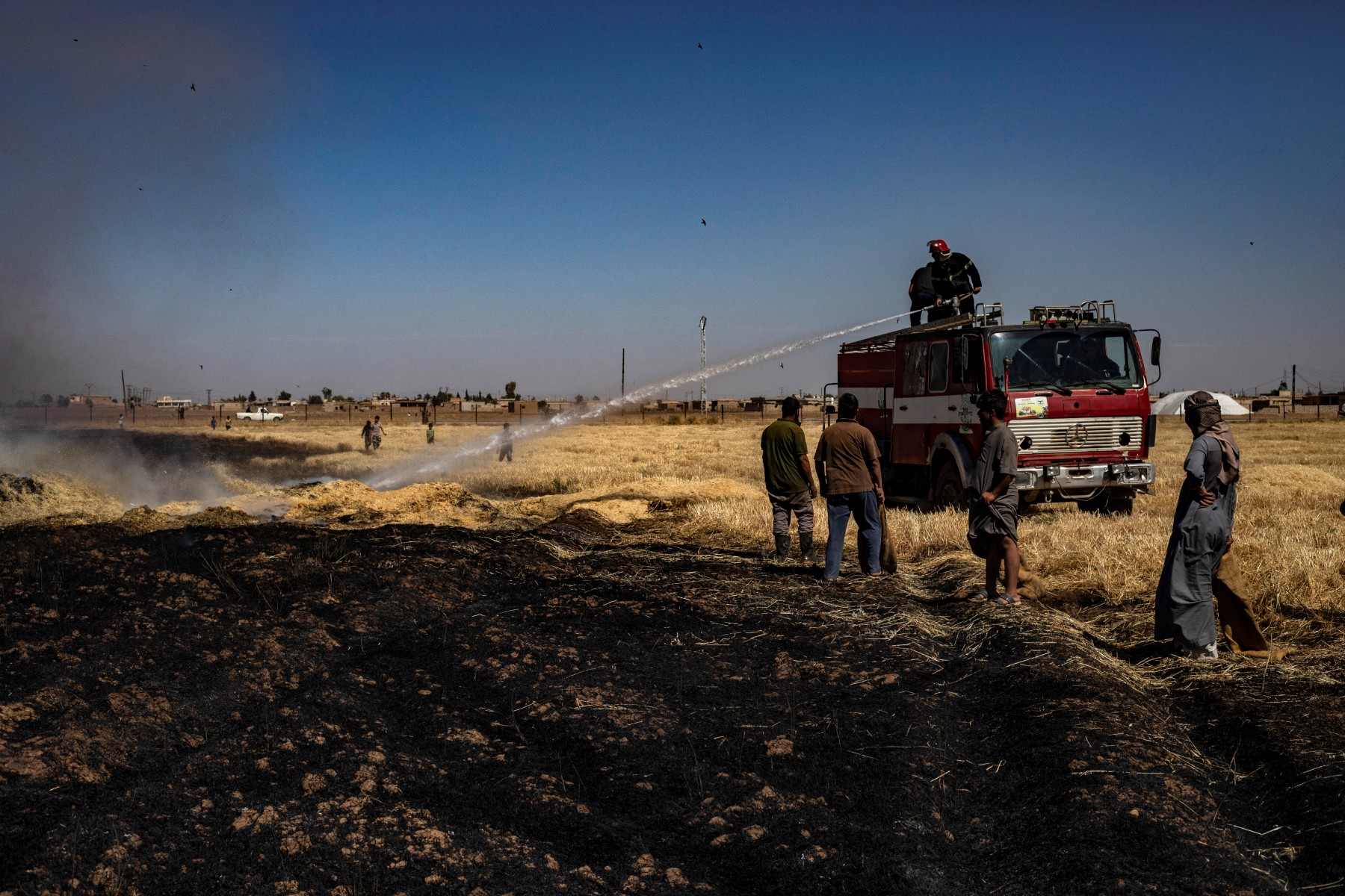 Widespread fires in parts of Syria during peak harvest season destroyed standing crops, says FEWS NET. (AFP file photo)