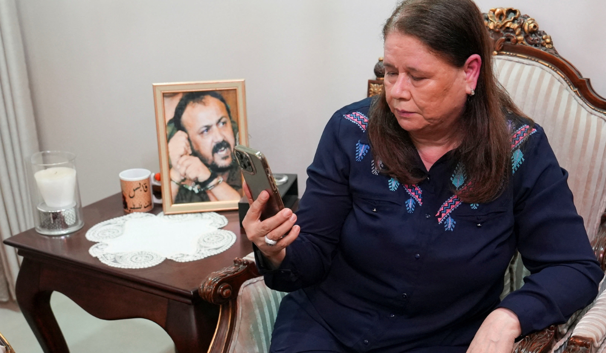 Fadwa Barghouti watches a video of the visit of the Israeli National Security Minister Itamar Ben-Gvir to her husband Marwan Barghouti, in Ramallah in the Israeli-occupied West Bank, August 15,2025. (REUTERS file photo)