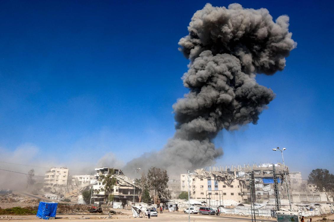 Above, a smoke plume billows after an earlier Israeli strike on an industrial area in Gaza City on July 12, 2026. (AFP)