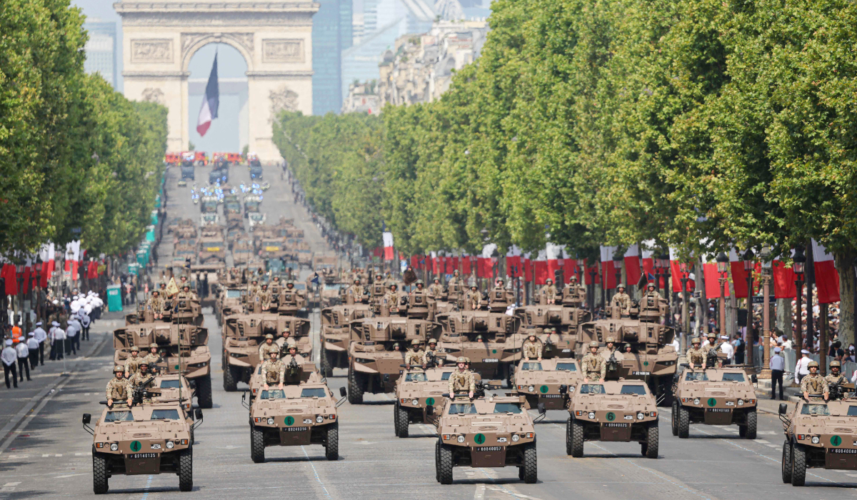 France's Armed Forces drive their motorised vehicles during the annual Bastille Day military parade on the Champs-Elysees Avenue in Paris on July 14, 2026. (AFP)