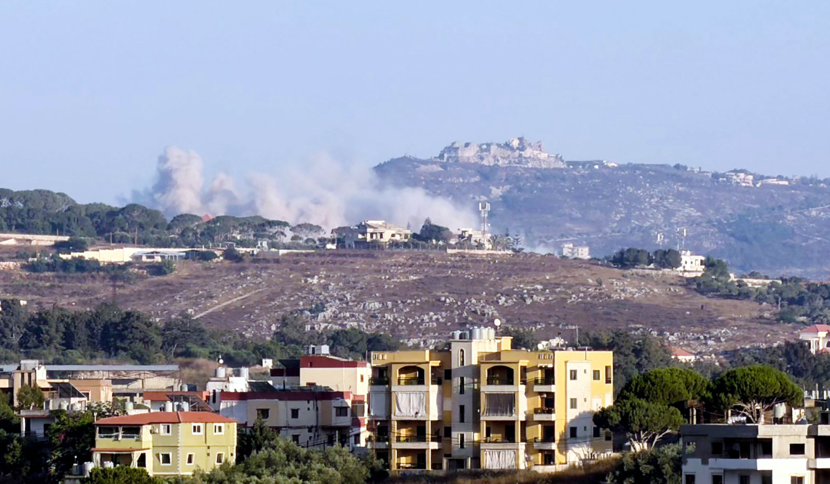 Smoke as it rises from the site of an Israeli-controlled explosion in the village of Kfar Tibnit, with the Beaufort citadel seen in the distance, on July 13, 2026. (AFP)
