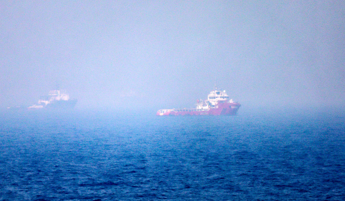 This picture shows ships sailing near the Strait of Hormuz off the eastern coast of the United Arab Emirates at Khor Fakkan on July 13, 2026. (AFP)