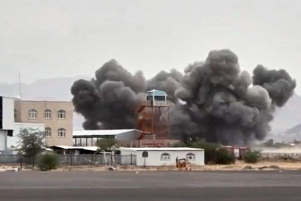 A screengrab taken from Al-Masirah TV, a Houthi-controlled news channel, shows an explosion at Sanaa International Airport, following a coalition airstrike, Yemen, July 13, 2026. (Al-Masirah TV via AP)
