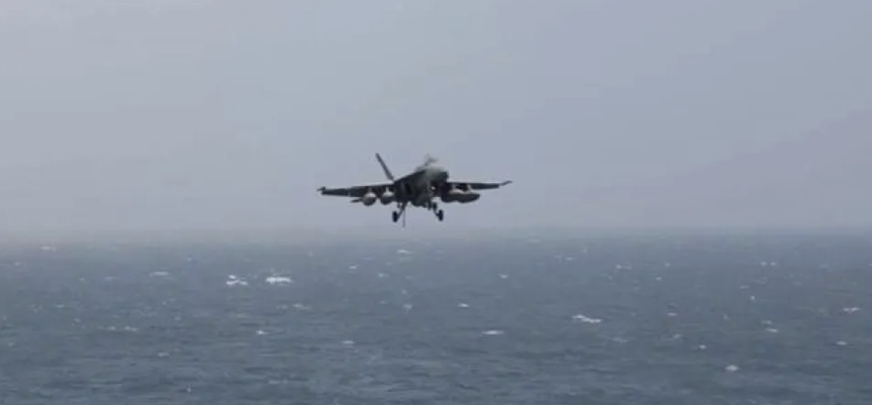 An aircraft prepares to land aboard the USS George HW Bush, at an unknown location, released July 14, 2026, in this still image taken from a handout video. (CENTCOM via Reuters)